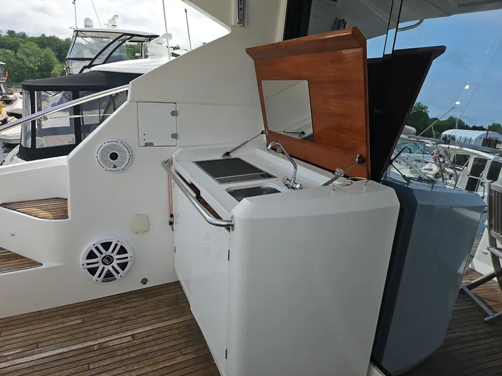  Yacht Photos Pics Outdoor kitchen on 2015 Beneteau Gran Turismo 49 yacht, featuring grill and sink.