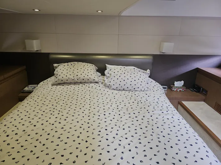  Yacht Photos Pics Luxurious bedroom interior of 2015 Beneteau Gran Turismo 49 yacht with patterned bedding.