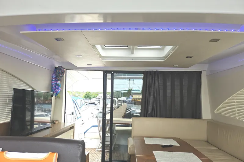  Yacht Photos Pics Interior of 2015 Beneteau GRAN TURISMO 49 yacht, featuring modern seating and skylight.
