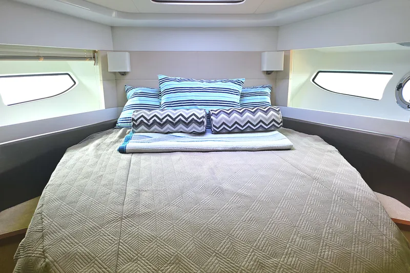  Yacht Photos Pics Luxurious cabin interior of 2015 Beneteau Gran Turismo 49 yacht with cozy bedding.