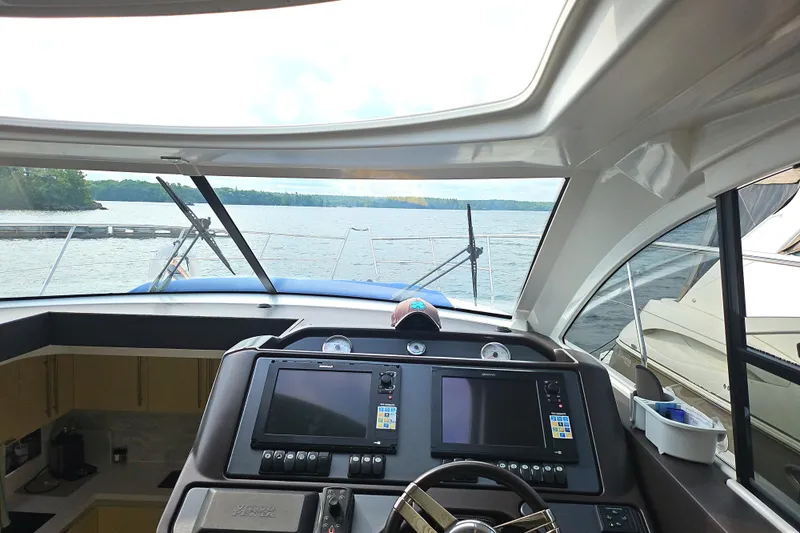  Yacht Photos Pics Interior view of 2015 Beneteau Gran Turismo 49 yacht cockpit with navigation screens.