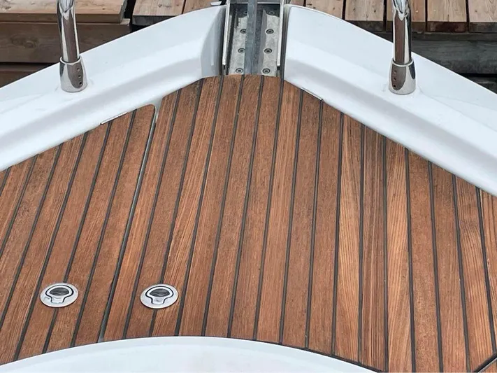  Yacht Photos Pics Teak deck of 2015 Beneteau GRAN TURISMO 49 yacht, featuring sleek wood finish.