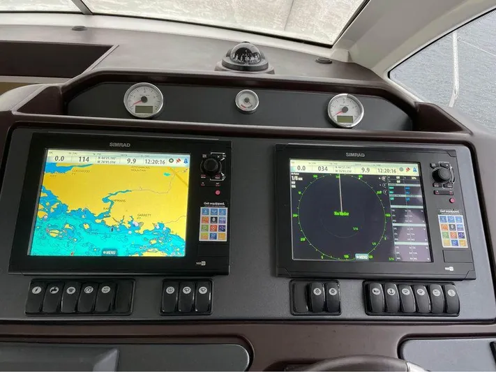  Yacht Photos Pics Navigation system of 2015 Beneteau GRAN TURISMO 49 yacht with dual Simrad displays.