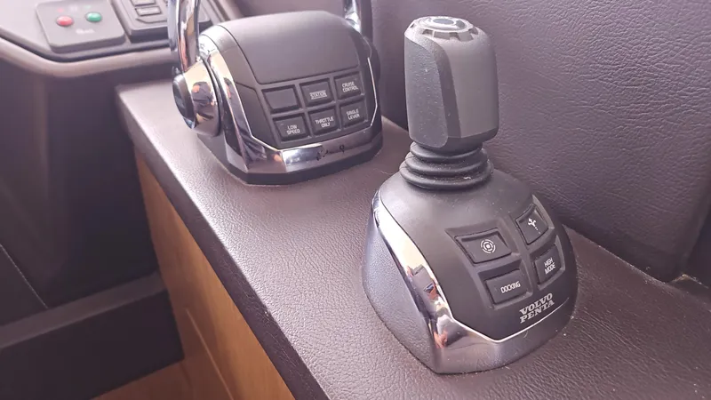  Yacht Photos Pics Control panel of a 2015 Beneteau GRAN TURISMO 49 yacht, featuring joystick and throttle.