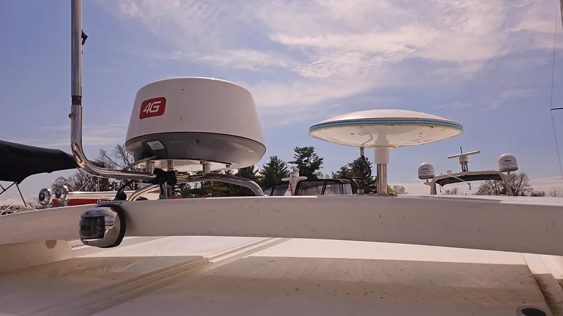  Yacht Photos Pics Radar equipment on a 2015 Beneteau GRAN TURISMO 49 yacht under a partly cloudy sky.