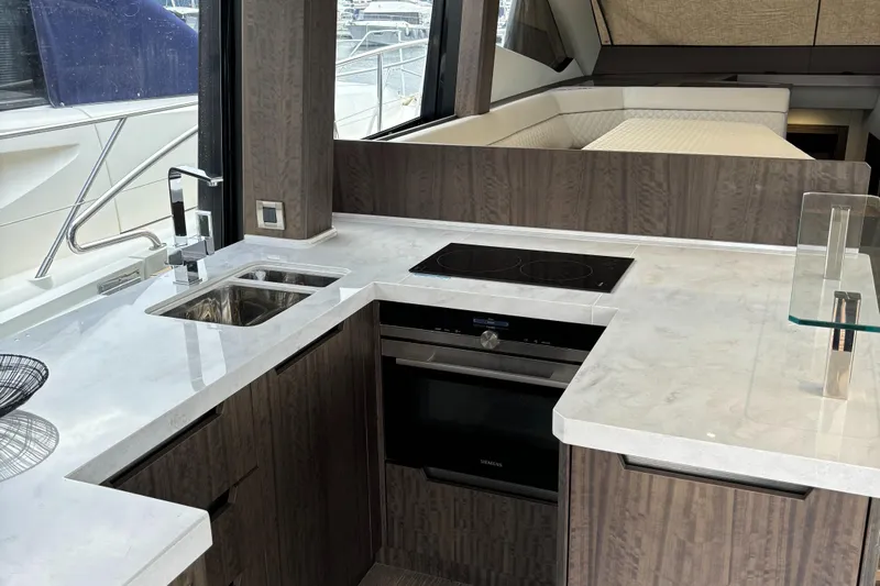  Yacht Photos Pics Modern kitchen interior of 2019 Galeon 500 Fly yacht with sleek countertops.