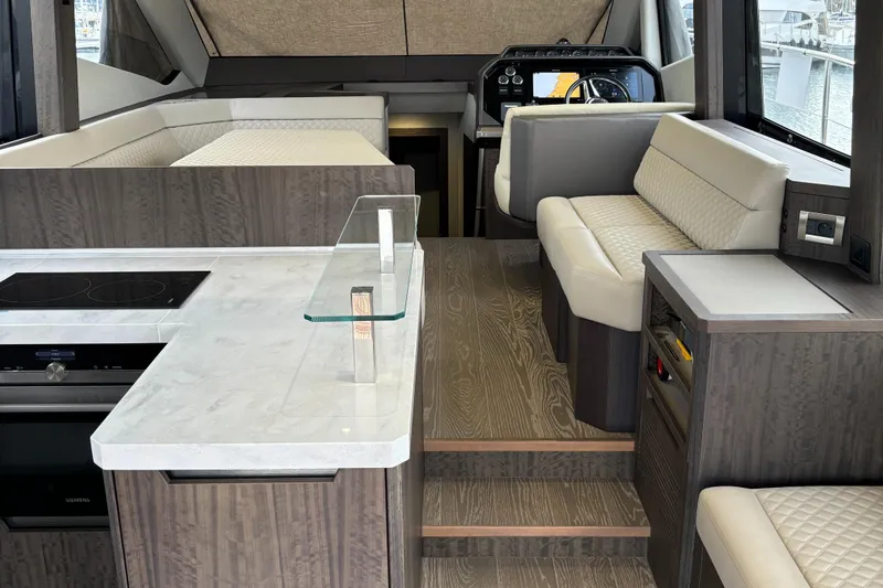  Yacht Photos Pics Luxurious interior of 2019 Galeon 500 Fly yacht with modern kitchen and seating area.