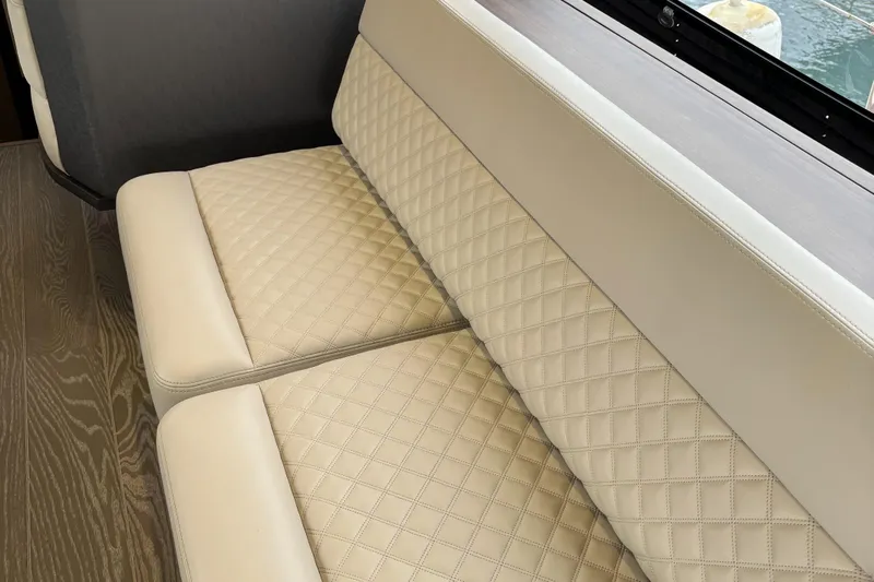  Yacht Photos Pics Luxurious beige seating on 2019 Galeon 500 Fly yacht with quilted design.