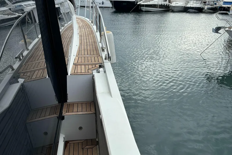  Yacht Photos Pics 2019 Galeon 500 Fly yacht docked, showcasing sleek design and wooden deck.