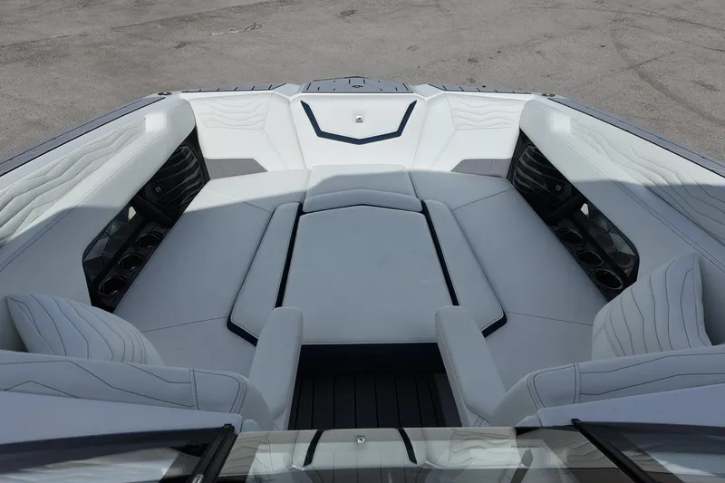  Yacht Photos Pics 2025 Nautique Super Air Nautique G25 boat interior with luxurious seating and cup holders.