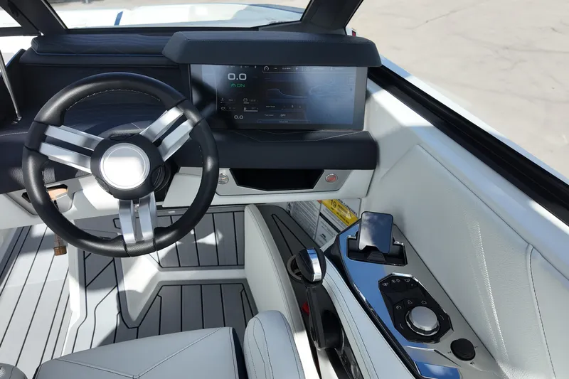  Yacht Photos Pics 2025 Nautique Super Air Nautique G25 cockpit with modern steering and digital display.
