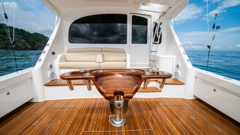El Lobo Yacht Photos Pics Luxury 2020 Viking 58 Convertible yacht interior with wooden deck and seating area.