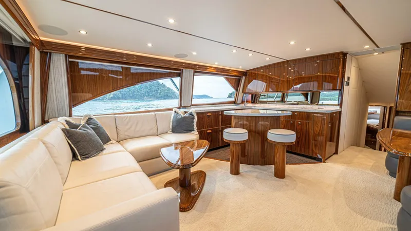 El Lobo Yacht Photos Pics Luxurious interior of 2020 Viking 58 Convertible yacht with elegant wood finishes and plush seating.