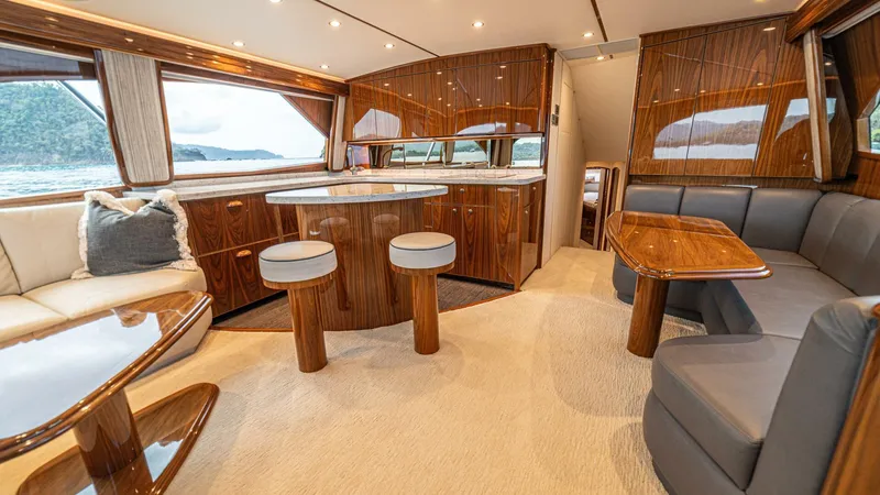 El Lobo Yacht Photos Pics Luxurious interior of a 2020 Viking 58 Convertible yacht with elegant wood finishes.