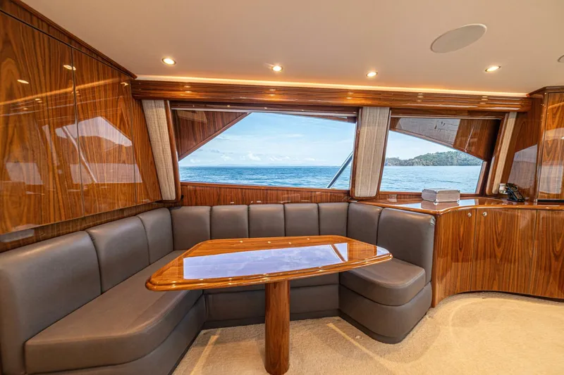 El Lobo Yacht Photos Pics Luxurious interior of 2020 Viking 58 Convertible yacht with ocean view through large windows.