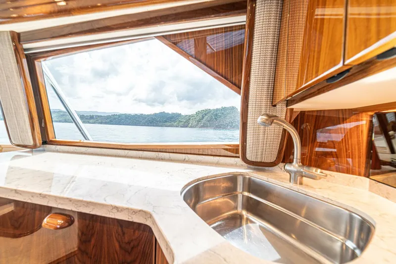 El Lobo Yacht Photos Pics Luxurious interior of 2020 Viking 58 Convertible yacht with scenic ocean view.