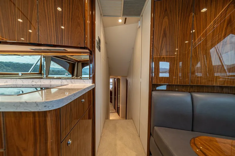El Lobo Yacht Photos Pics Luxurious interior of 2020 Viking 58 Convertible yacht with wood finishes and modern design.