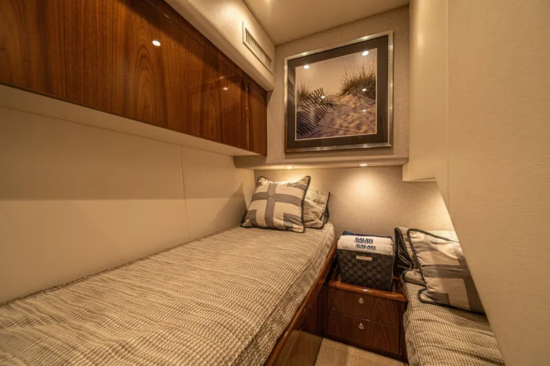 El Lobo Yacht Photos Pics Luxurious cabin interior of 2020 Viking 58 Convertible yacht with twin beds and elegant decor.