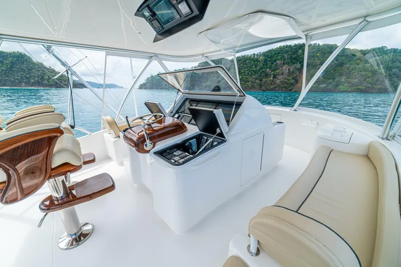 El Lobo Yacht Photos Pics Luxurious interior of 2020 Viking 58 Convertible yacht with scenic ocean view.
