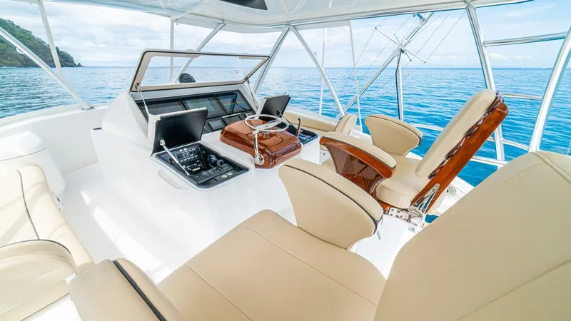 El Lobo Yacht Photos Pics Luxurious 2020 Viking 58 Convertible yacht interior with beige seating and ocean view.