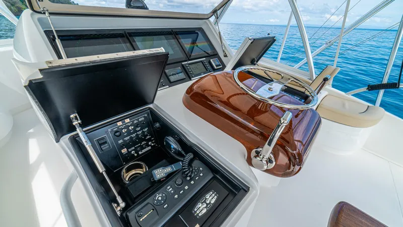 El Lobo Yacht Photos Pics 2020 Viking 58 Convertible yacht helm with advanced navigation controls and ocean view.