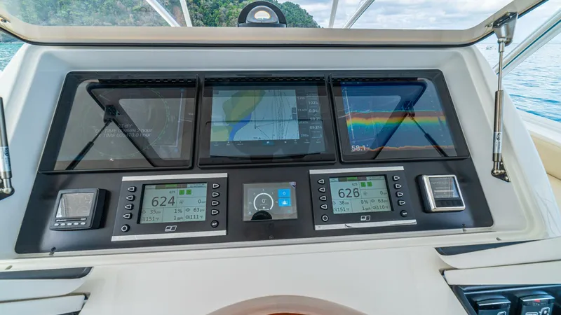 El Lobo Yacht Photos Pics Control panel of a 2020 Viking 58 Convertible yacht with navigation displays.