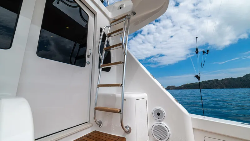 El Lobo Yacht Photos Pics Viking 58 Convertible 2020 yacht with ladder, ocean view, and fishing rods.