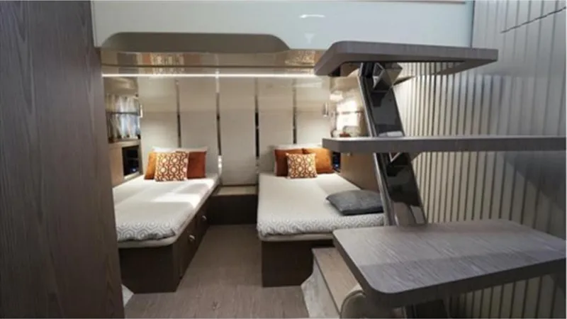  Yacht Photos Pics Luxurious cabin interior of 2021 Invictus TT460 yacht with twin beds and modern decor.