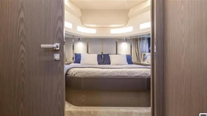  Yacht Photos Pics Luxurious interior of 2021 Invictus TT460 yacht with elegant bedroom design.
