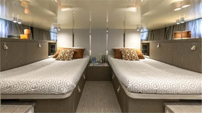  Yacht Photos Pics Luxurious twin cabin interior of 2021 Invictus TT460 yacht with modern decor and ambient lighting.