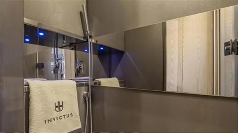  Yacht Photos Pics Luxury bathroom interior of 2021 Invictus TT460 yacht with sleek design and branded towel.