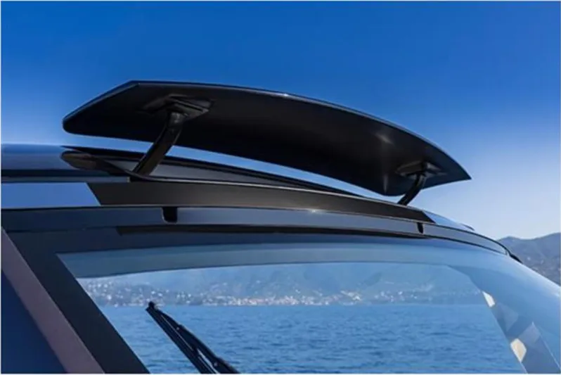  Yacht Photos Pics 2021 Invictus TT460 boat with sleek roof spoiler, ocean backdrop.