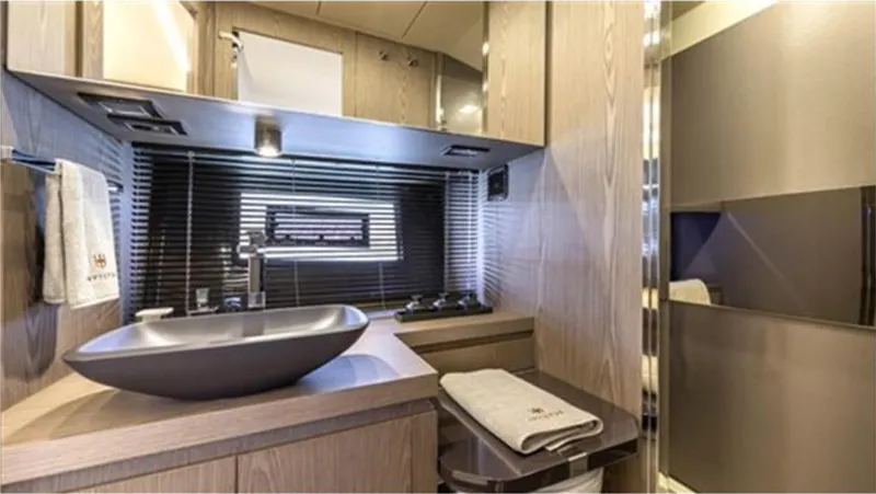  Yacht Photos Pics Luxurious bathroom interior of 2021 Invictus TT460 yacht with modern sink and elegant design.