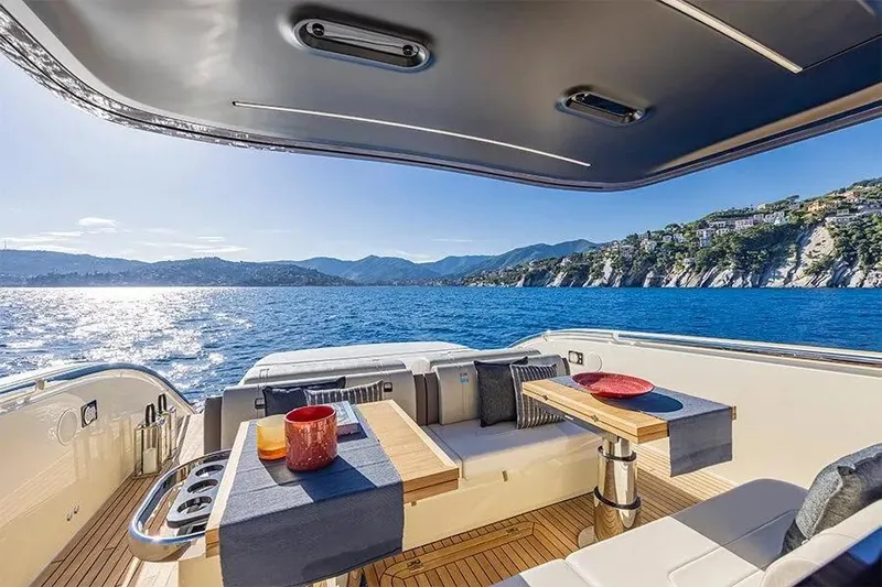  Yacht Photos Pics Luxurious 2021 Invictus TT460 yacht with scenic ocean and mountain views.