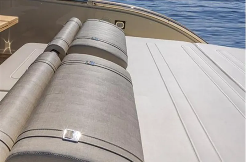  Yacht Photos Pics Luxury seating on 2021 Invictus TT460 yacht, featuring elegant design and ocean backdrop.