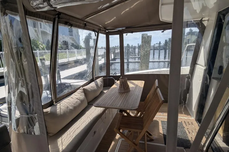 Fly Girl Yacht Photos Pics 2020 Fountaine Pajot MY 37 yacht interior with cozy seating and wooden table.