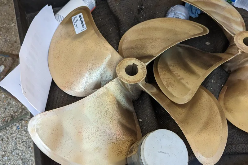 Fly Girl Yacht Photos Pics Bronze propeller for 2020 Fountaine Pajot MY 37 yacht, displayed on a workbench.