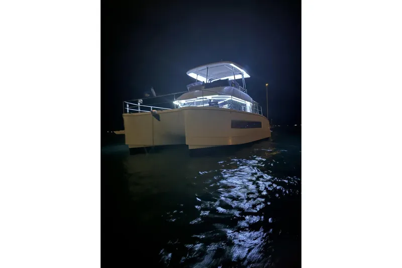 Fly Girl Yacht Photos Pics 2020 Fountaine Pajot MY 37 yacht illuminated at night on the water.