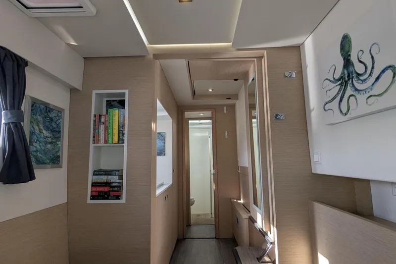 Fly Girl Yacht Photos Pics Interior of 2020 Fountaine Pajot MY 37 yacht with modern decor and bookshelf.