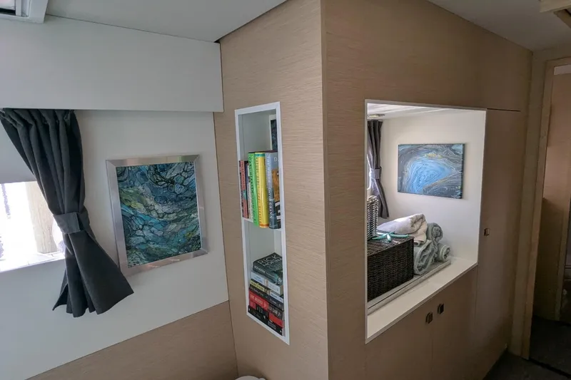 Fly Girl Yacht Photos Pics Interior of 2020 Fountaine Pajot MY 37 yacht with modern decor and bookshelf.