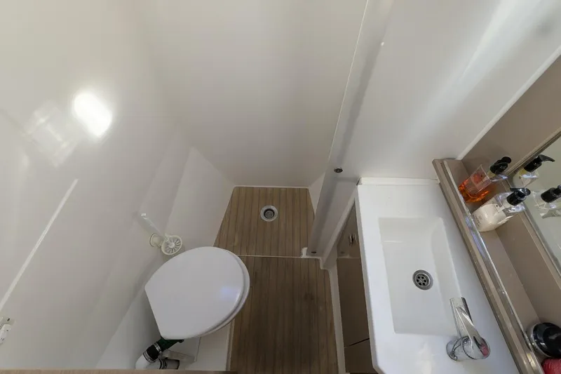 Fly Girl Yacht Photos Pics Bathroom interior of 2020 Fountaine Pajot MY 37 yacht, featuring sink and toilet.