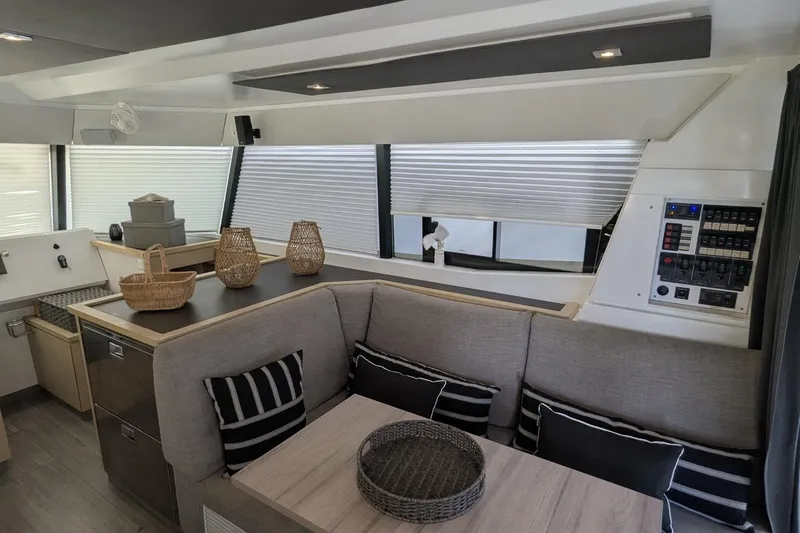Fly Girl Yacht Photos Pics Modern interior of 2020 Fountaine Pajot MY 37 yacht with cozy seating and stylish decor.