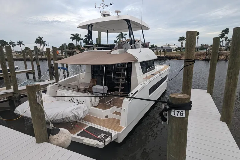 Fly Girl Yacht Photos Pics 2020 Fountaine Pajot MY 37 yacht docked at marina with palm trees.