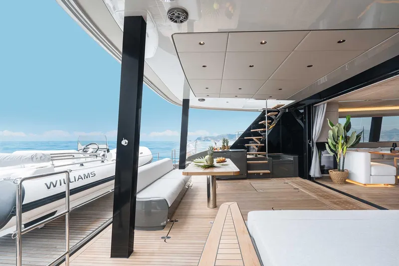 Candy Yacht Photos Pics Luxurious Sunreef 70 yacht interior, 2021 model, featuring elegant deck and modern furnishings.