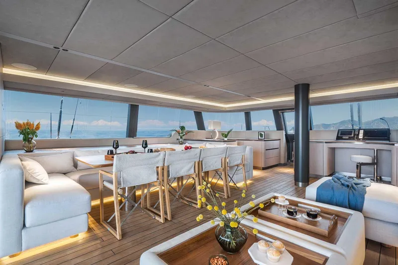 Candy Yacht Photos Pics Luxurious interior of 2021 Sunreef 70 yacht with elegant seating and panoramic windows.