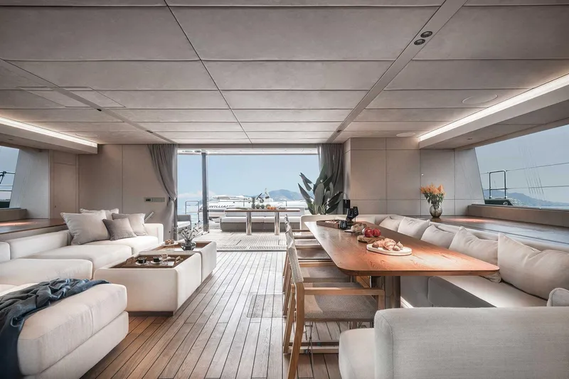 Candy Yacht Photos Pics Luxurious interior of 2021 Sunreef 70 yacht with elegant seating and dining area.