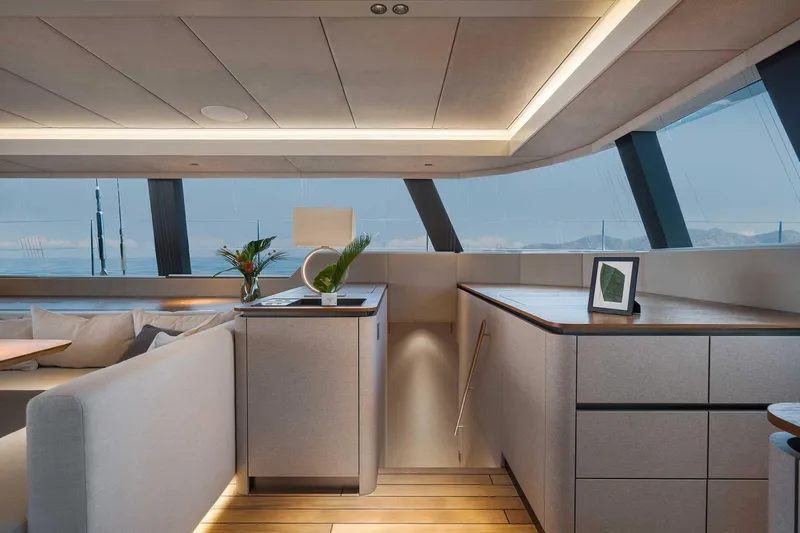 Candy Yacht Photos Pics Luxurious interior of 2021 Sunreef 70 yacht with modern design and panoramic windows.