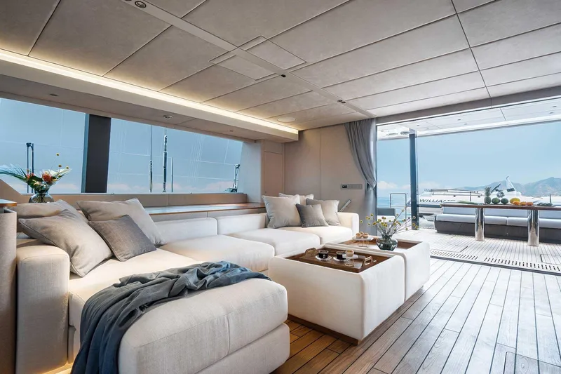 Candy Yacht Photos Pics Luxurious interior of 2021 Sunreef 70 yacht with elegant seating and ocean view.