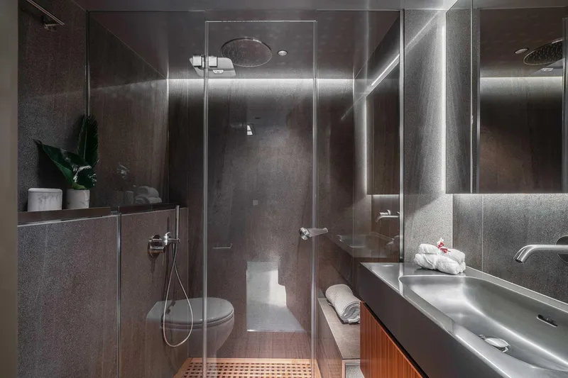 Candy Yacht Photos Pics Luxurious bathroom in 2021 Sunreef 70 yacht with modern fixtures and elegant design.