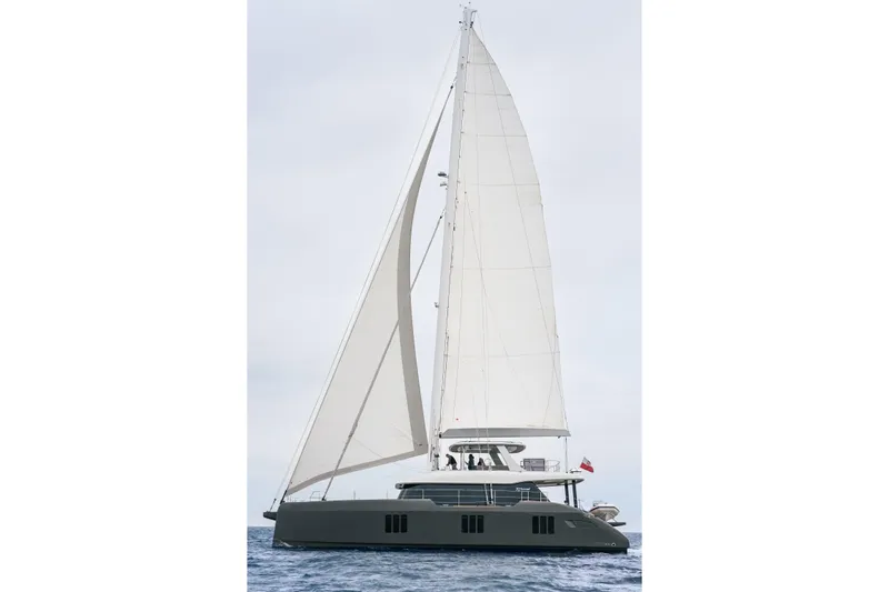 Candy Yacht Photos Pics 2021 Sunreef 70 sailing yacht with full sails on open water.